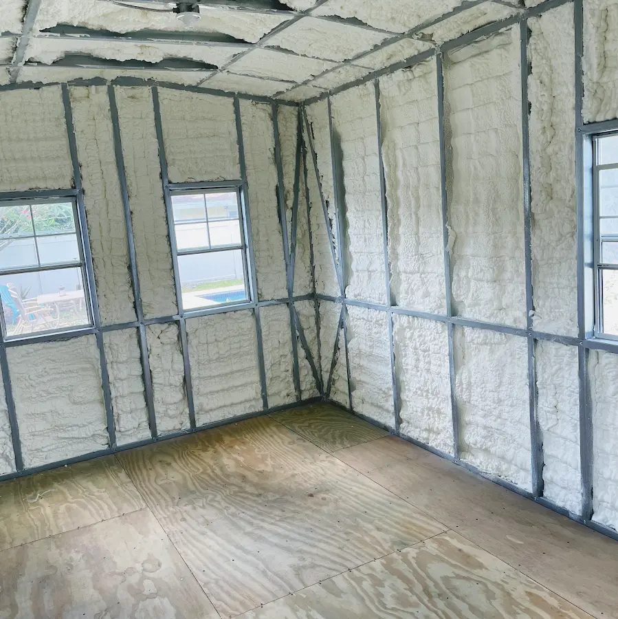 Closed-cell spray foam insulation applied to wall cavities in a residential project in McLean